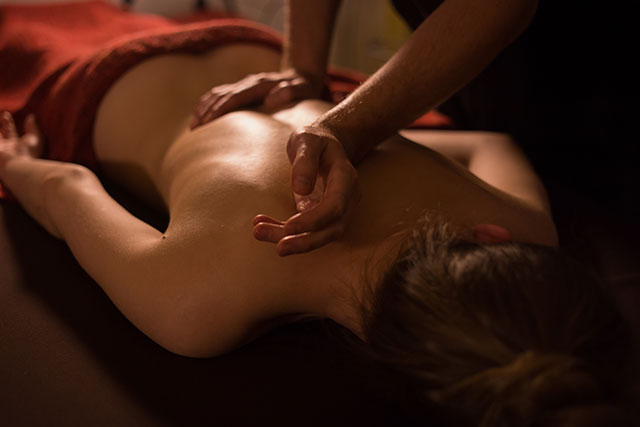 Woman receiving massage on her back