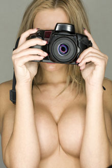 Naked woman taking photos