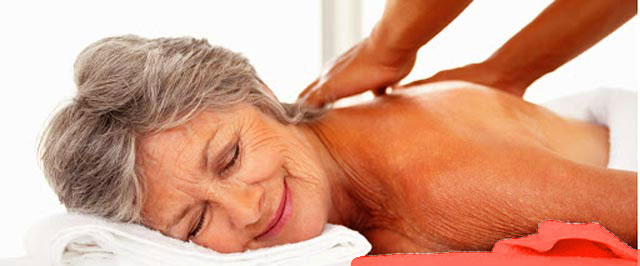 Older woman enjoying a massage lying down on massage table