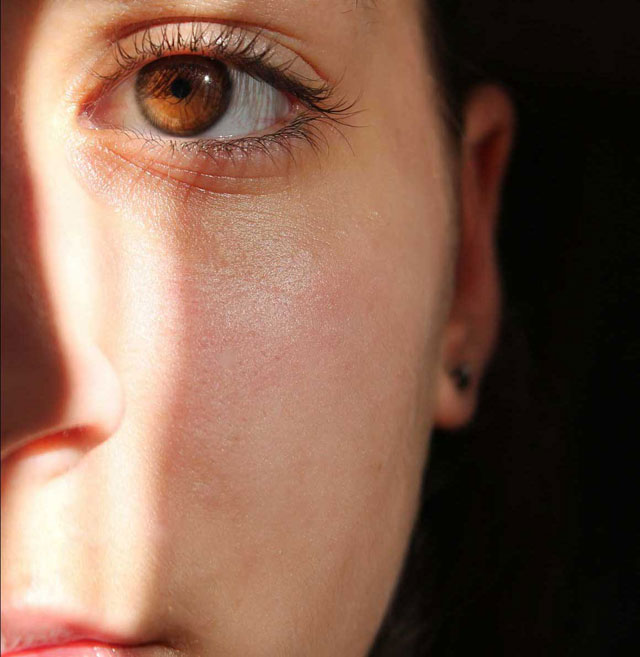 Womans half face showing left eye