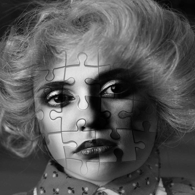 Womans face with imprint of jigsaw puzzle