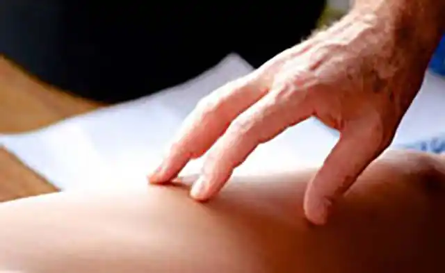 Image of woman relaxing while having a massage