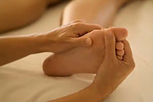 Image of woman relaxing while having a massage