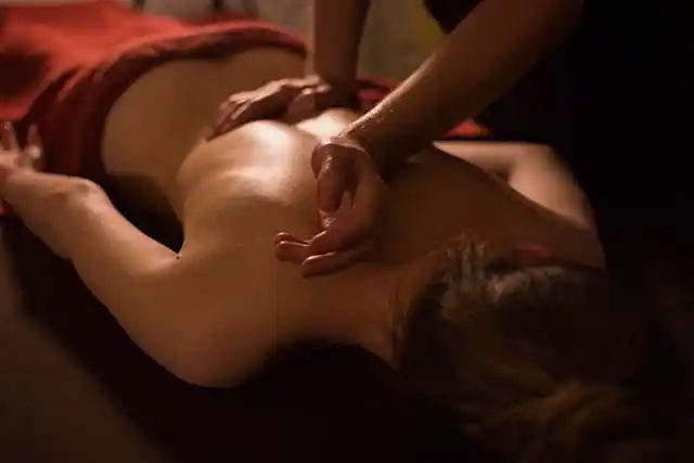 Image of woman relaxing while having a massage